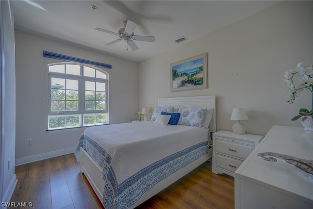 bedroom featuring ceiling fan and dark hardwood / wood-style flooring