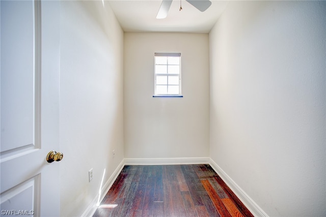 spare room with ceiling fan and dark hardwood / wood-style flooring