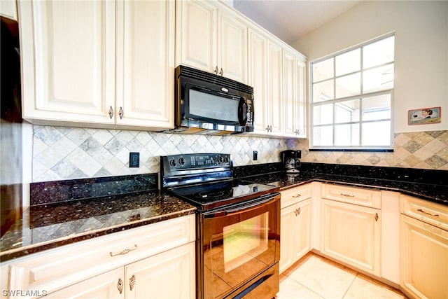 kitchen with backsplash, dark stone counters, light tile floors, and black appliances