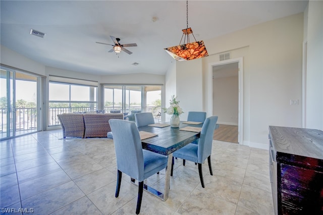 dining room featuring light tile flooring and ceiling fan