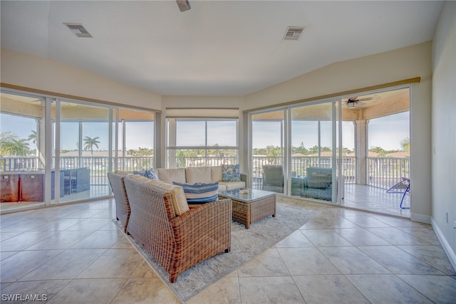 tiled living room with ceiling fan