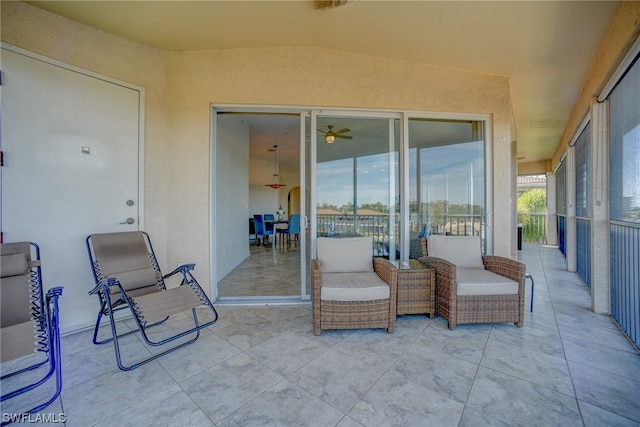 exterior space featuring ceiling fan