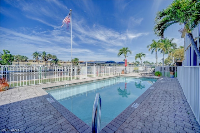 view of swimming pool with a patio