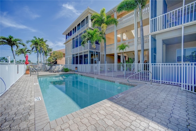 view of swimming pool featuring a patio