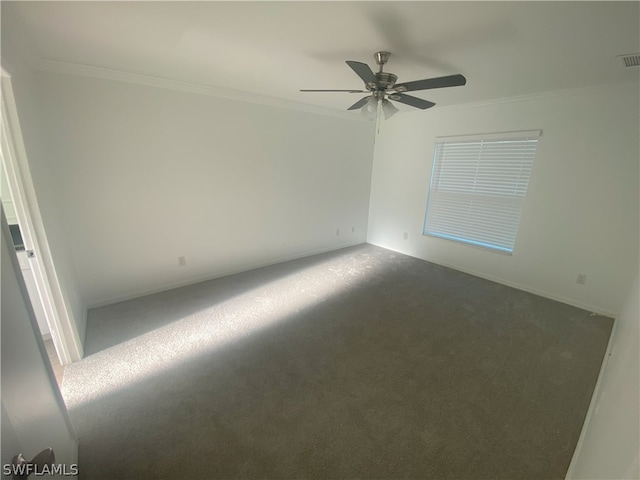 carpeted empty room with ceiling fan and crown molding