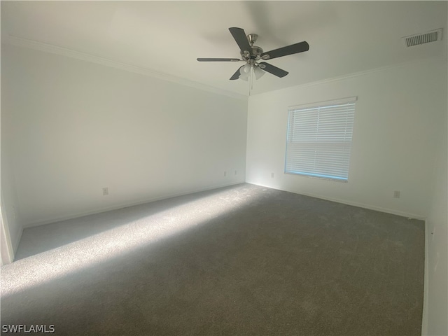 carpeted empty room with crown molding and ceiling fan