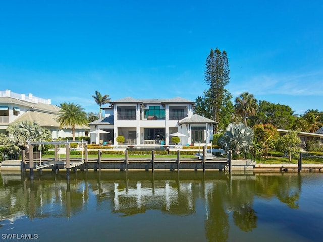 back of house with a water view