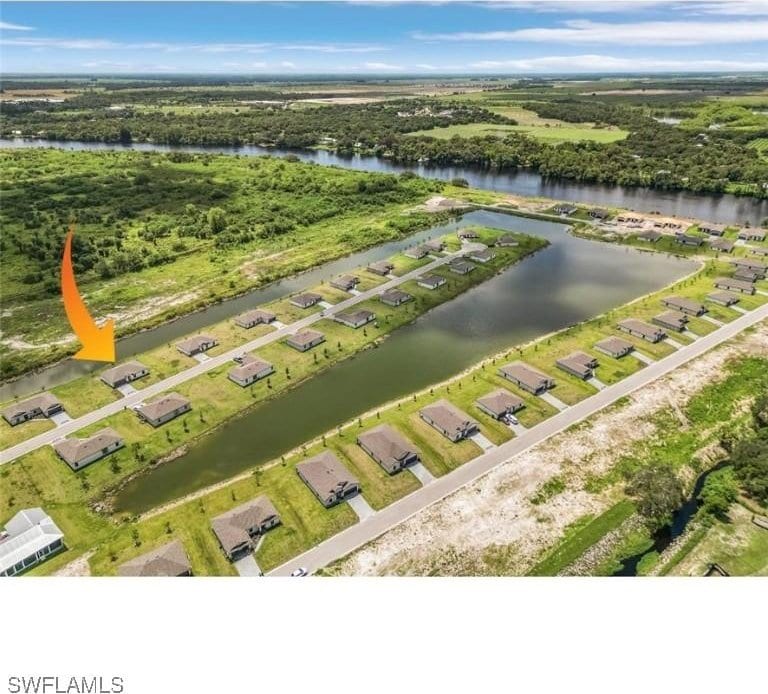 birds eye view of property featuring a water view