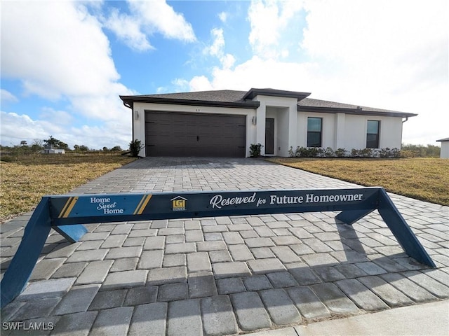 view of front of property with a garage