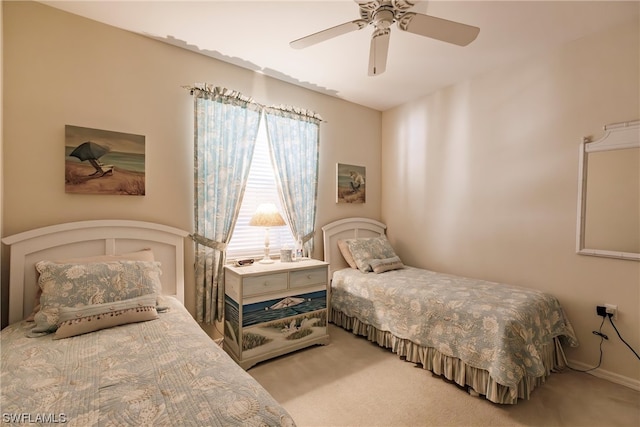 bedroom featuring ceiling fan and light colored carpet