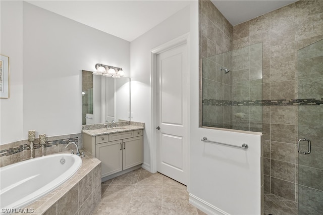 bathroom featuring tile patterned floors, vanity, and plus walk in shower