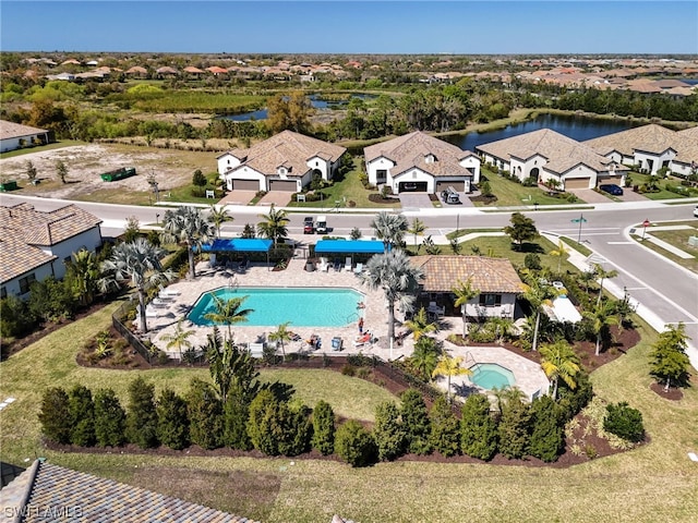 birds eye view of property featuring a water view