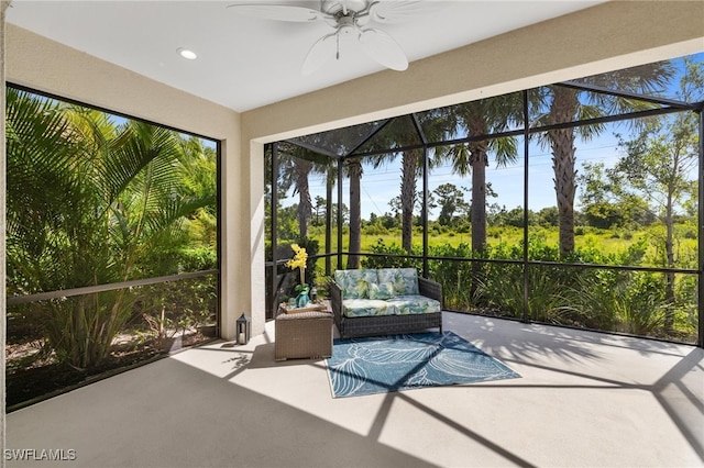 unfurnished sunroom featuring plenty of natural light and ceiling fan