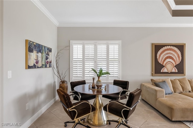 dining room featuring light tile patterned floors and crown molding