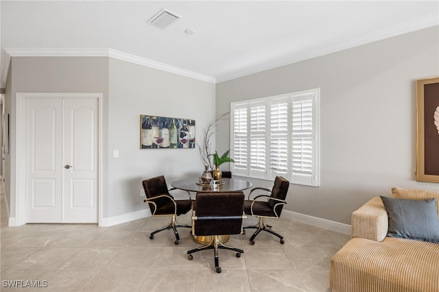 tiled dining room featuring ornamental molding