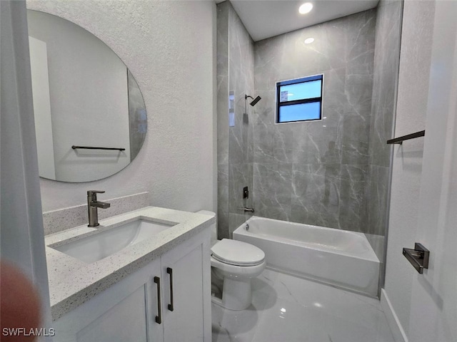 full bathroom featuring vanity, toilet, and tiled shower / bath