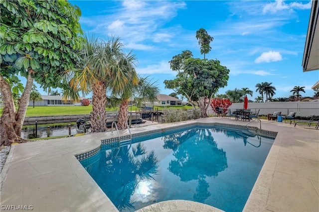 view of swimming pool featuring a patio