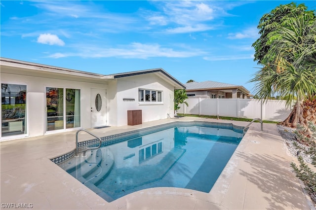 view of swimming pool featuring a patio