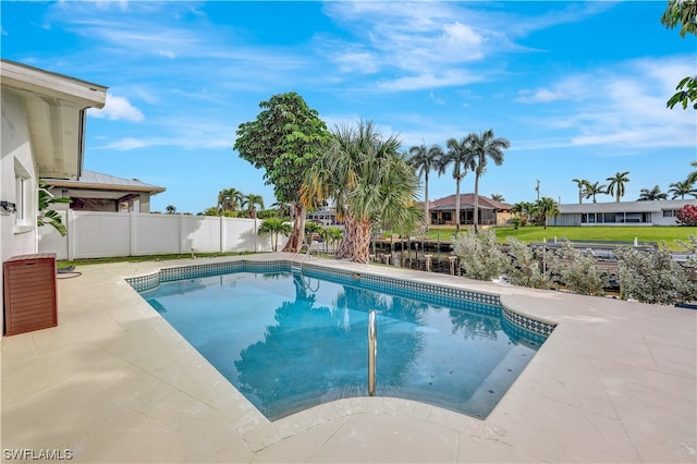 view of swimming pool with a patio