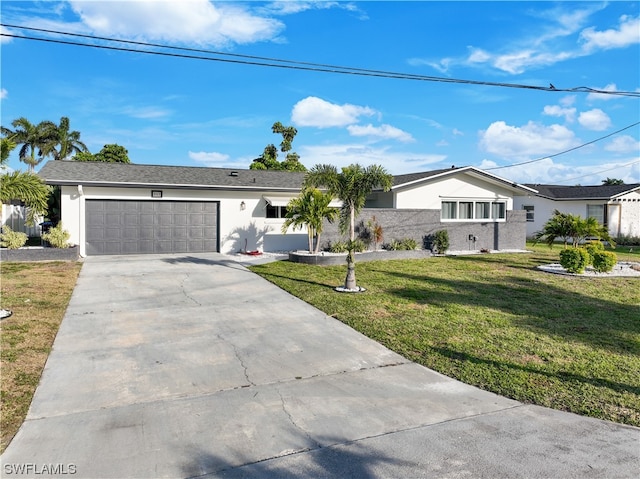 single story home with a front yard and a garage