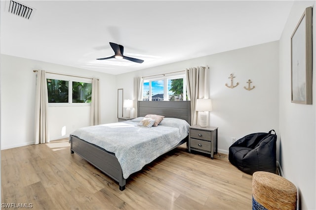 bedroom featuring light hardwood / wood-style floors and ceiling fan