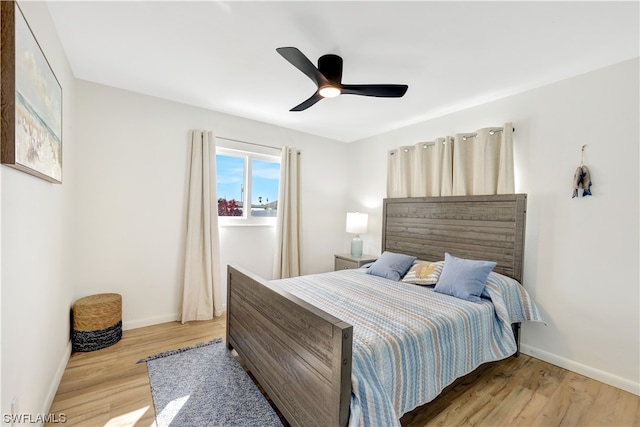 bedroom featuring light hardwood / wood-style floors and ceiling fan