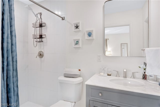 bathroom with vanity, a shower with curtain, and toilet