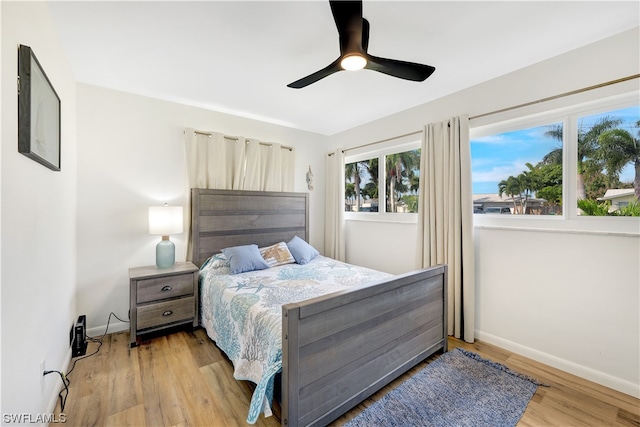 bedroom featuring ceiling fan and light hardwood / wood-style flooring