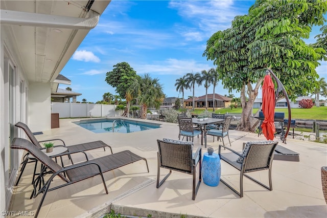 view of swimming pool featuring a patio area