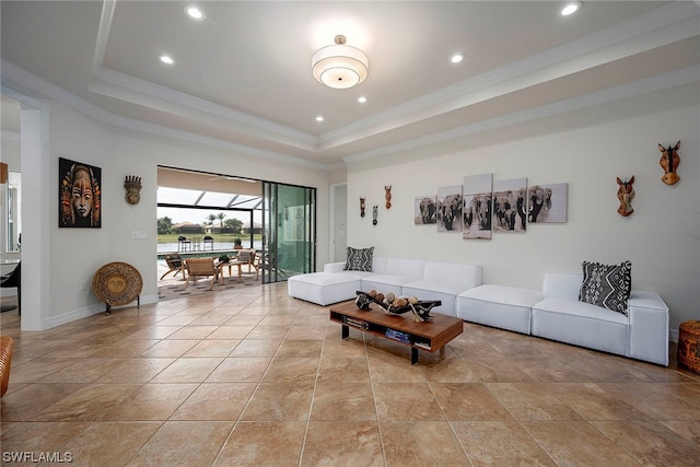 tiled living room featuring a raised ceiling