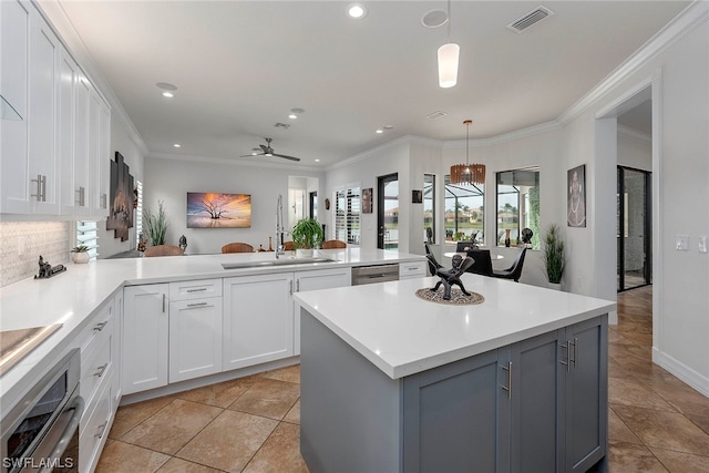 kitchen featuring hanging light fixtures, gray cabinetry, ceiling fan, light tile flooring, and stainless steel appliances