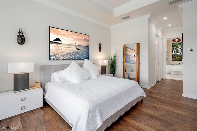 bedroom featuring ensuite bathroom, dark hardwood / wood-style floors, and crown molding