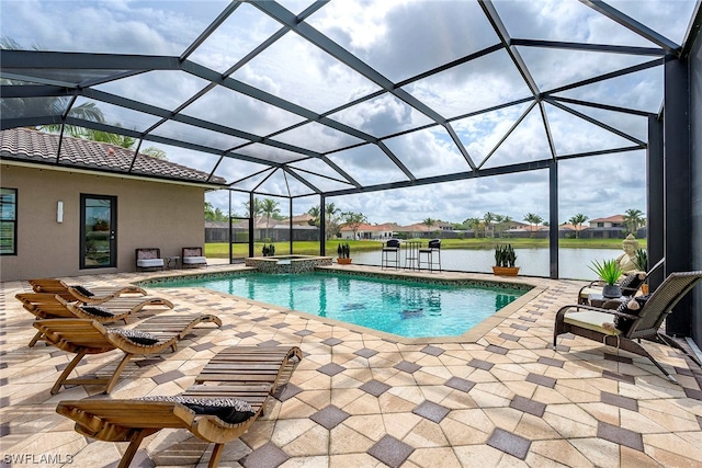 view of swimming pool with a patio area, a water view, and a lanai