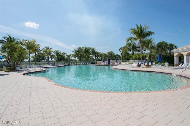 community pool with a patio area