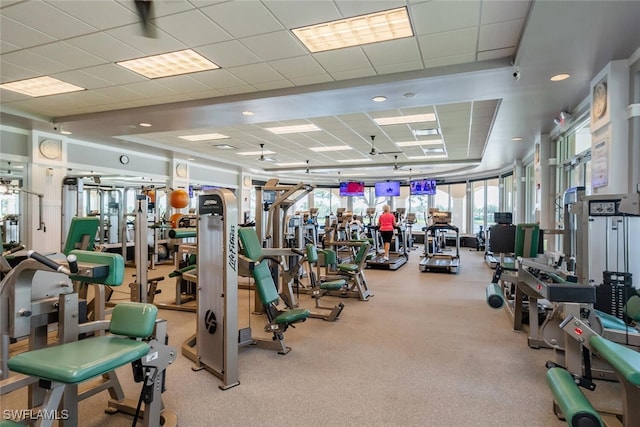 exercise room with a paneled ceiling