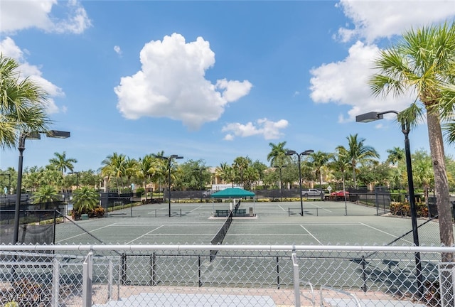 view of sport court featuring fence