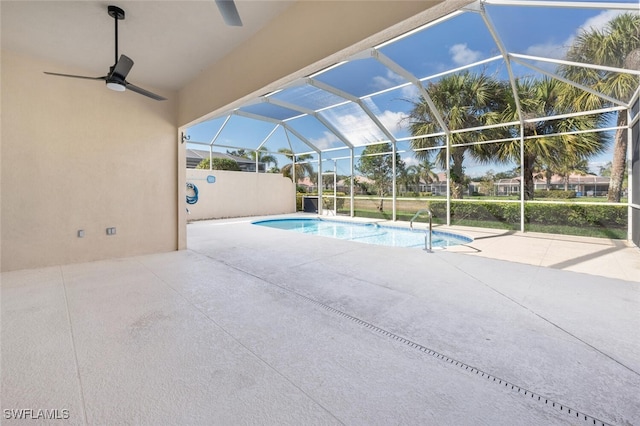 pool with a lanai, ceiling fan, and a patio