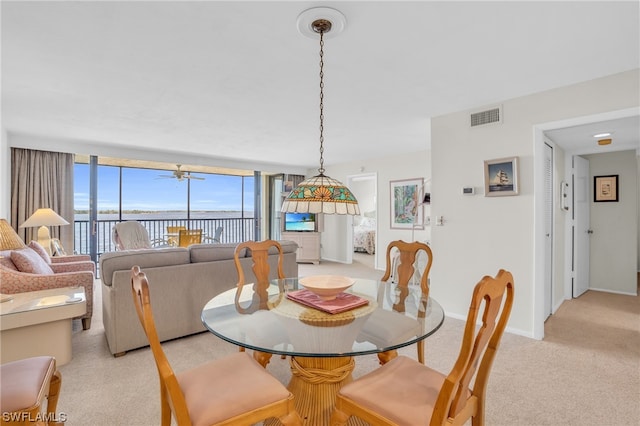 view of carpeted dining space