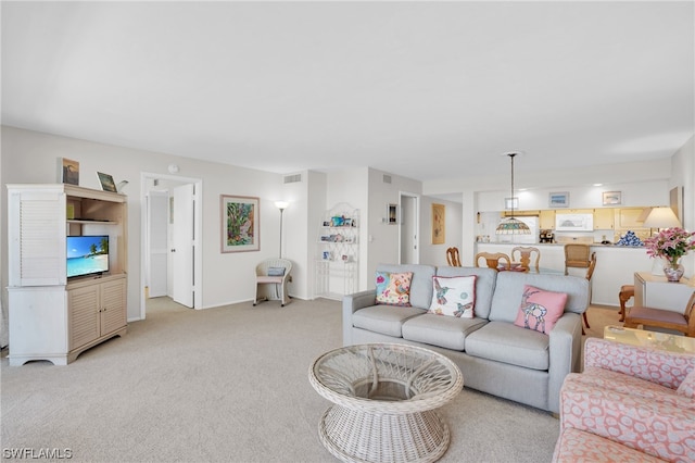 living room featuring light colored carpet