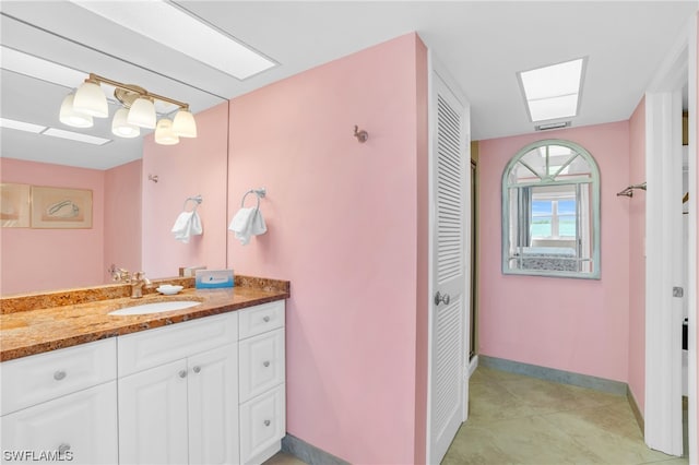 bathroom featuring vanity and tile patterned flooring