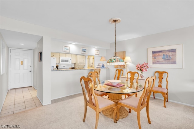 view of carpeted dining area