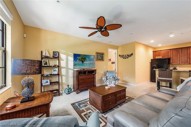 tiled living room featuring ceiling fan