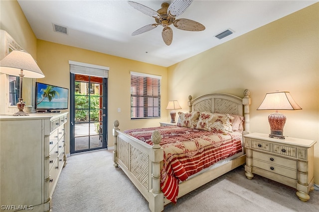 carpeted bedroom featuring ceiling fan and access to exterior