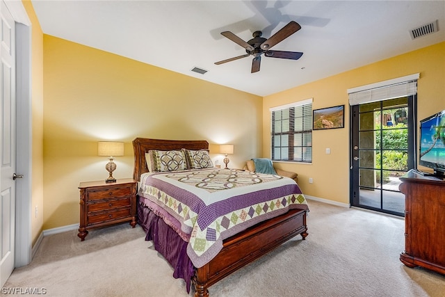 bedroom with ceiling fan, access to exterior, and light carpet