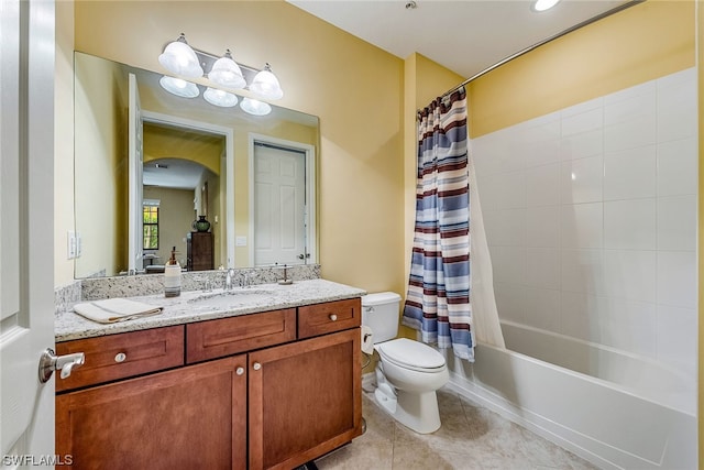 full bathroom with tile floors, toilet, shower / bathtub combination with curtain, and vanity