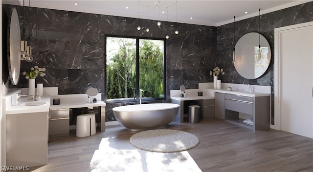 bathroom featuring a bath to relax in, tile walls, vanity, and hardwood / wood-style flooring