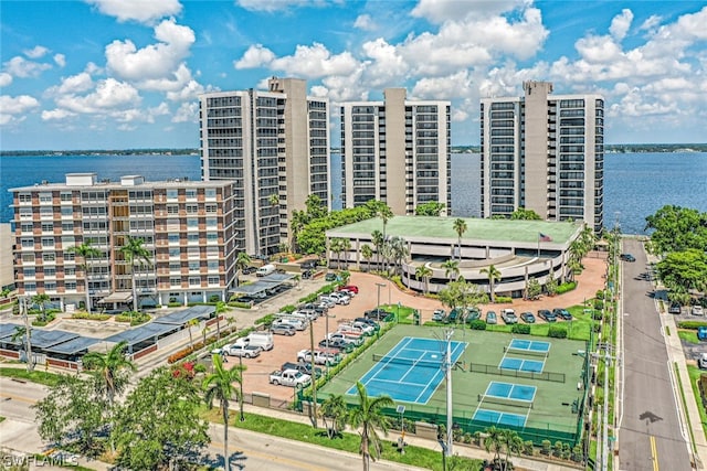 birds eye view of property with a water view