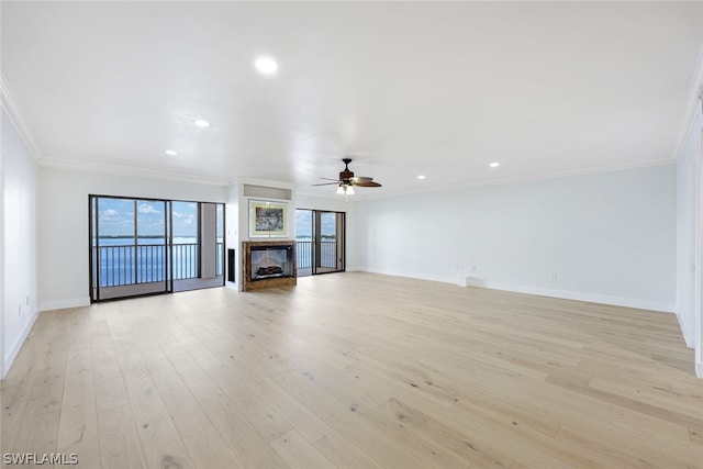1920 Virginia Ave Unit 1502, Fort Myers, FL 33901 - unfurnished living room featuring a ceiling fan, ornamental molding, a fireplace, recessed lighting, and light wood-type flooring
