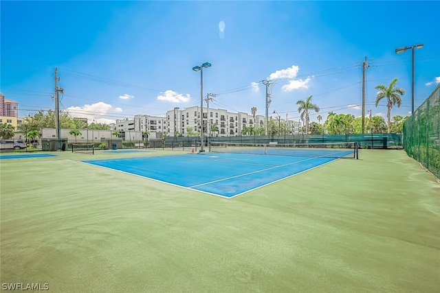 view of tennis court featuring basketball court