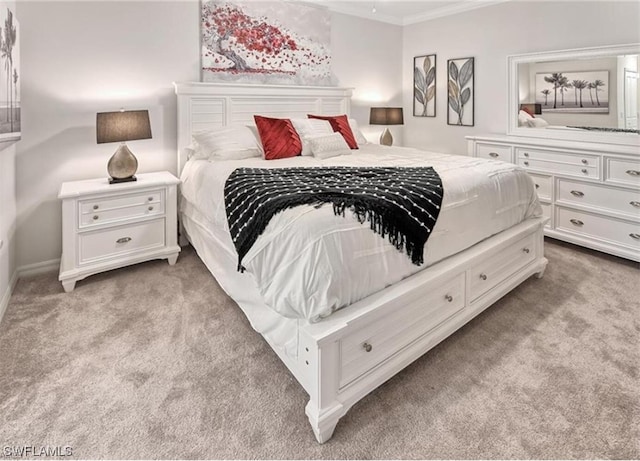 carpeted bedroom featuring crown molding